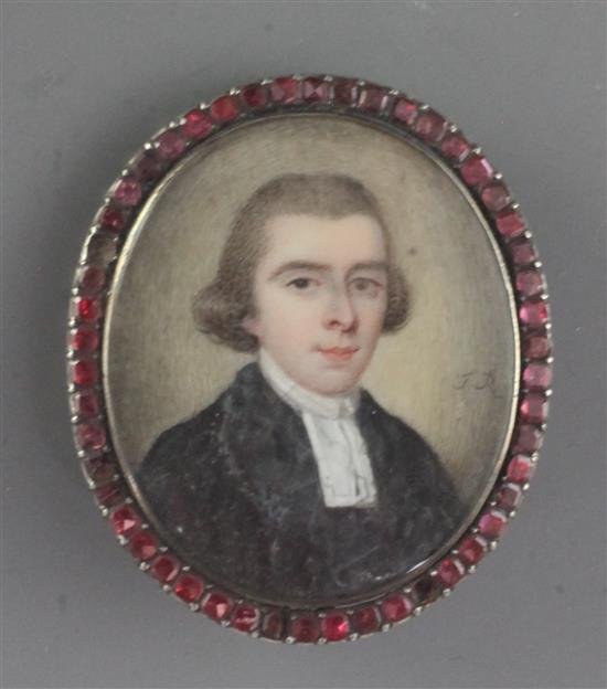 Early 19th century English School Miniature of a cleric, initialled J.R, 1.5 x 1.25in. gem set silver clasp frame.